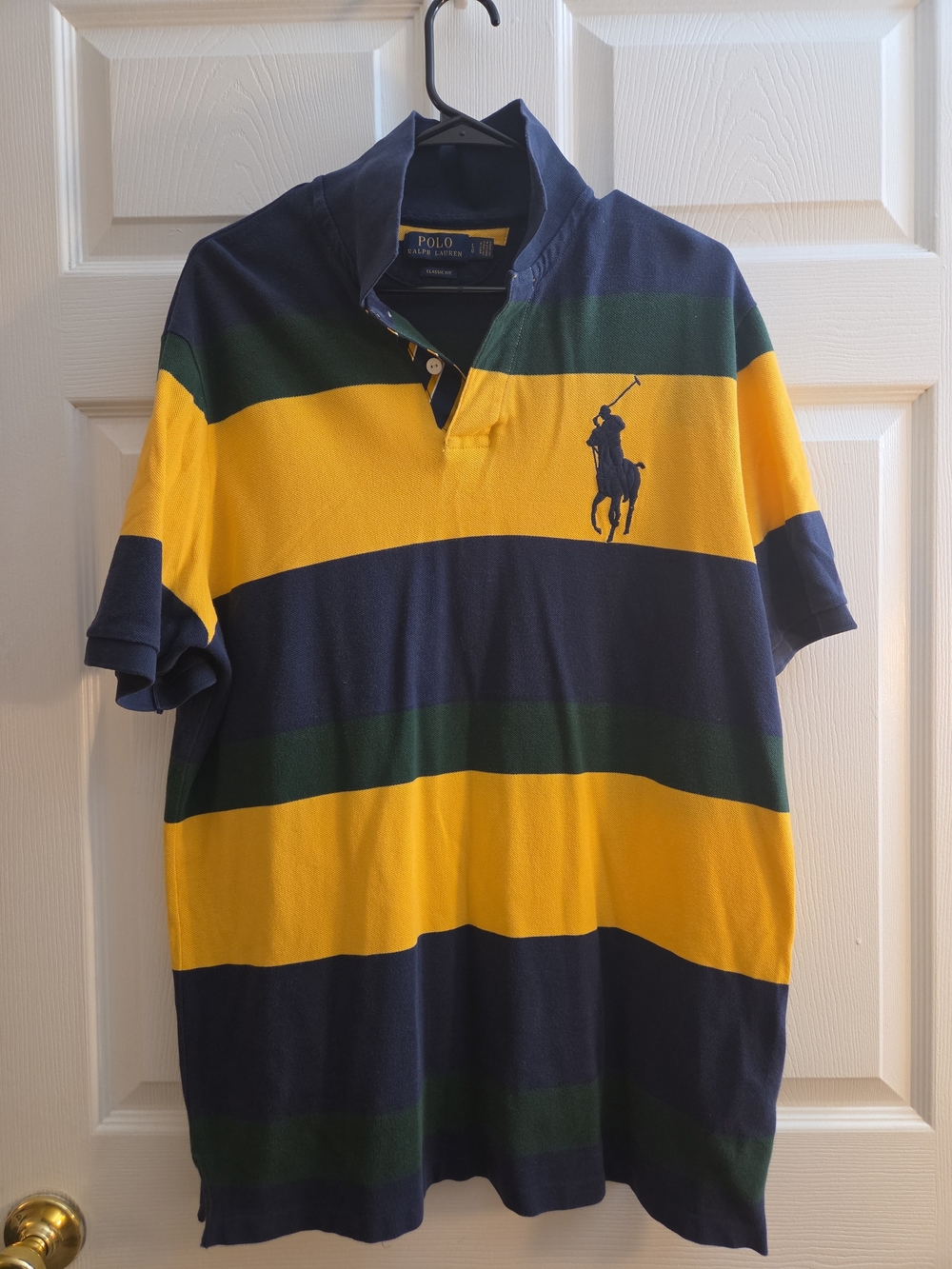A Polo Ralph Lauren navy, yellow, and green striped short-sleeve.